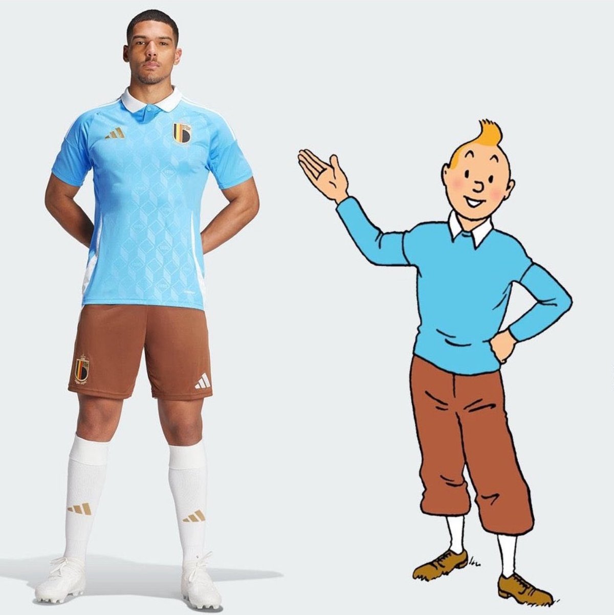 a Belgian football player standing next to a cartoon version of Tintin, each with a blue top and brown short pants