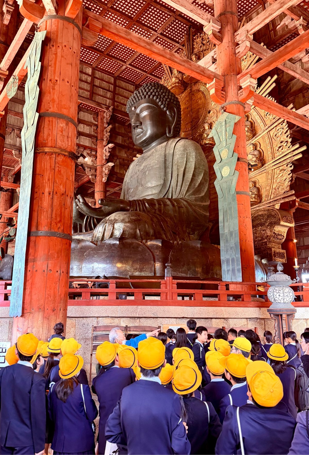 the Great Buddha and a group of adorably chapeaued schoolchildren at the Todai-ji Temple in Nara.