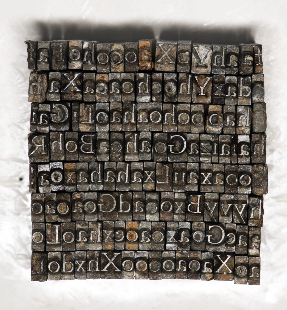 a collection of metal sorts from a typeface that's been at the bottom of a river for over a century