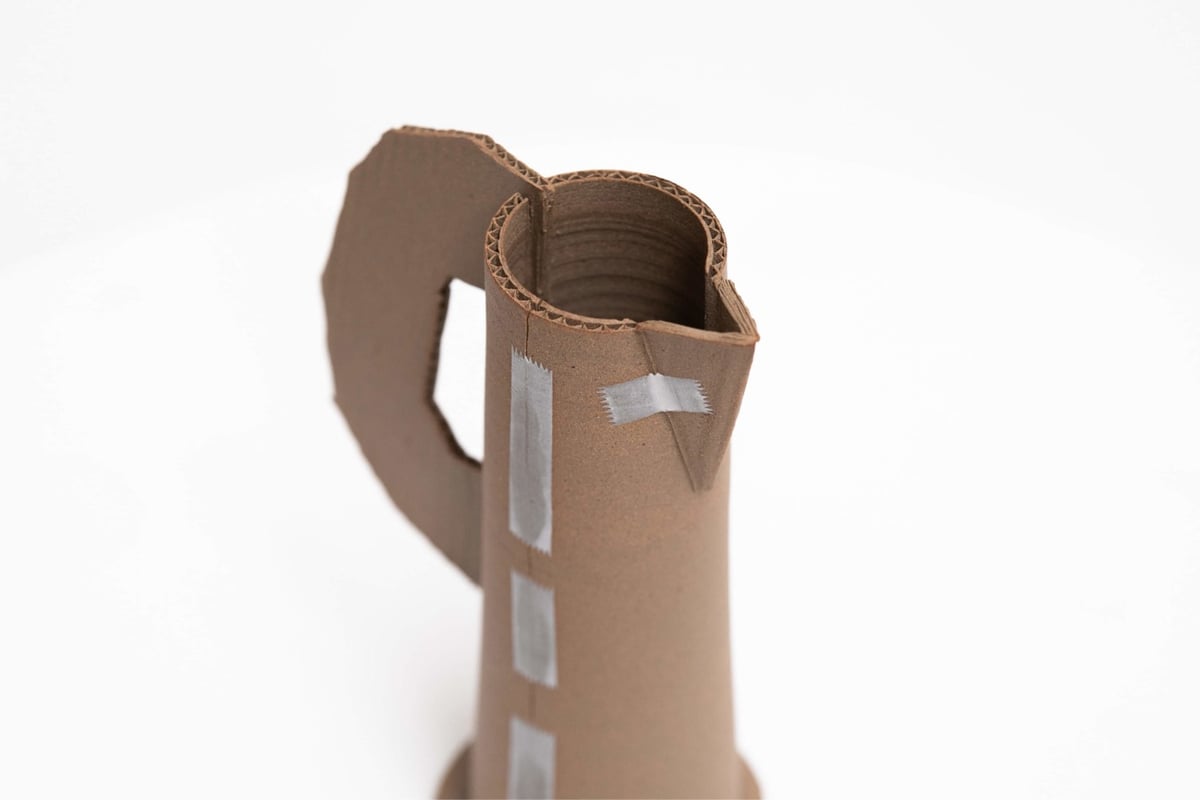 ceramic pitcher that looks like it's made out of cardboard