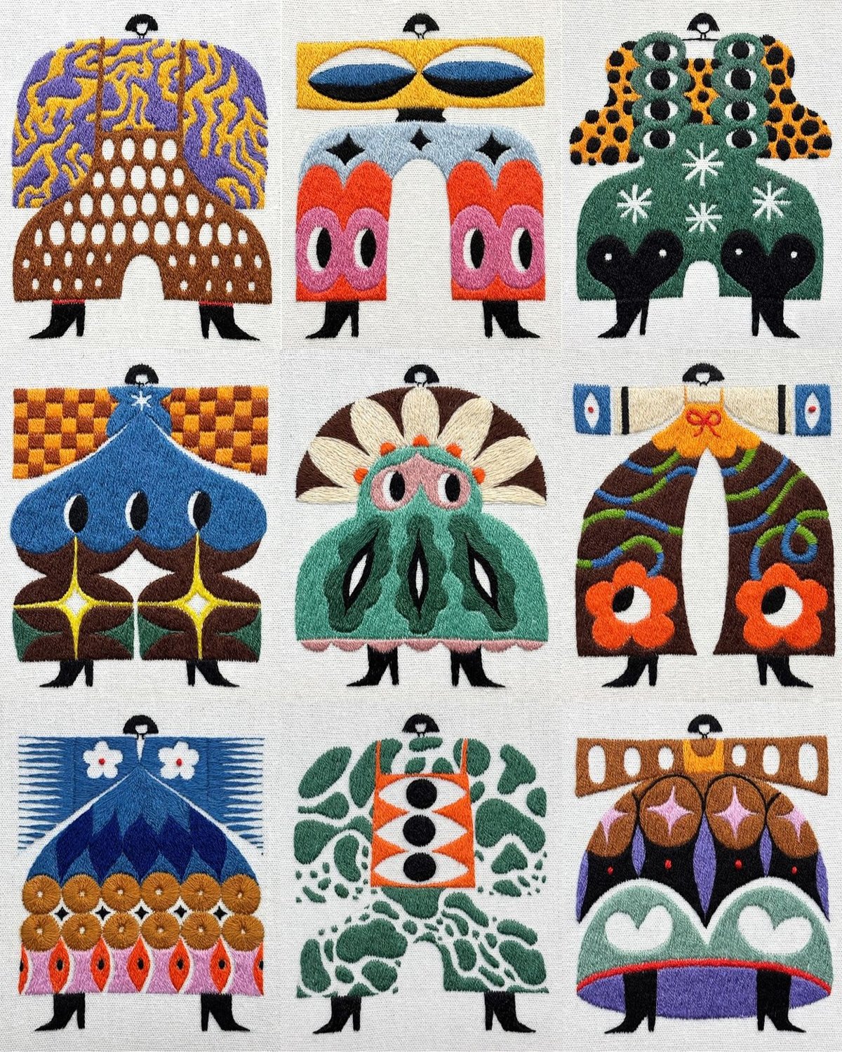 Nine embroidered figures in vibrant, uniquely patterned coats with geometric and floral motifs