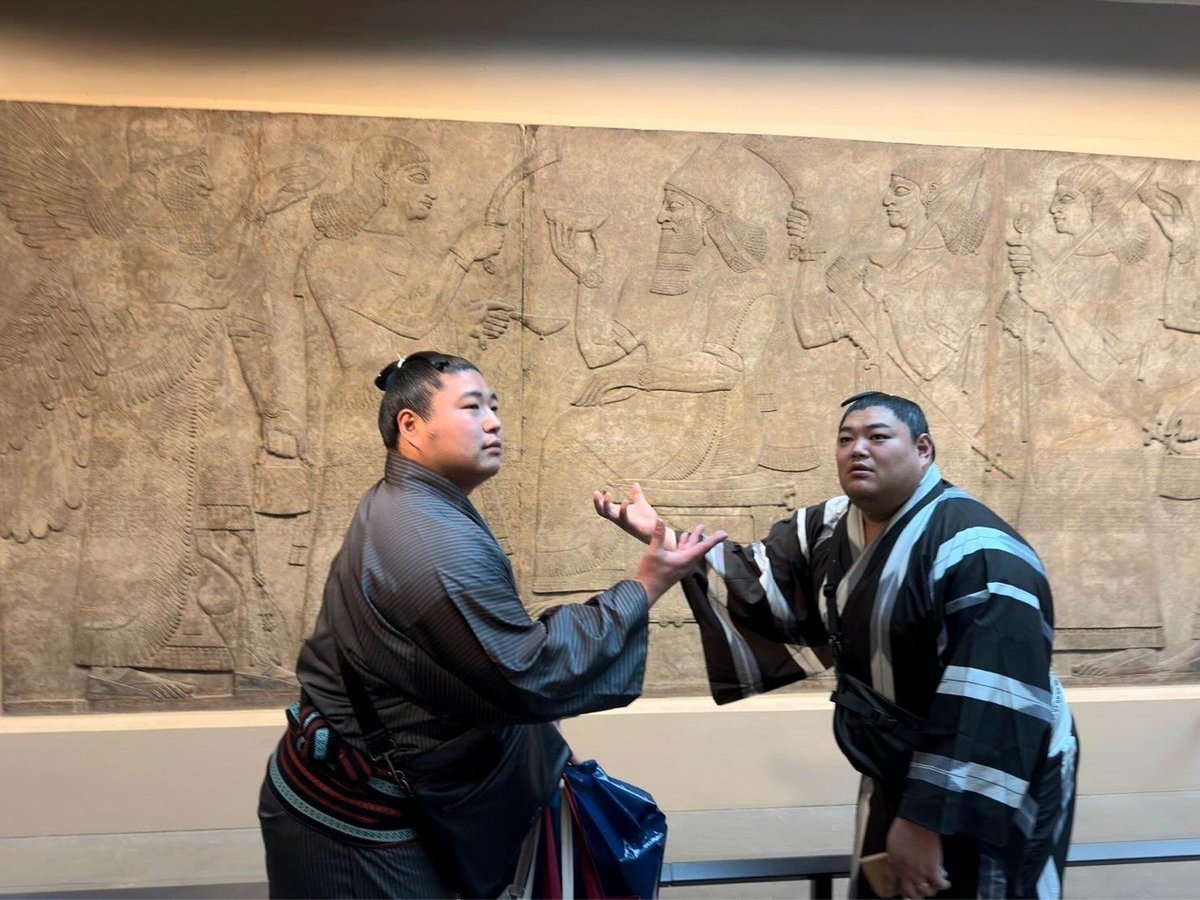 two sumo wrestlers posing at the British Museum