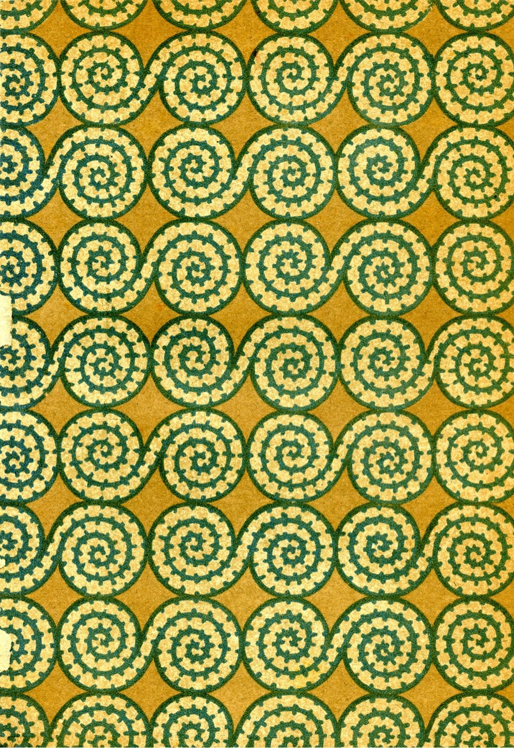 a pattern of light green spirals on an orange background