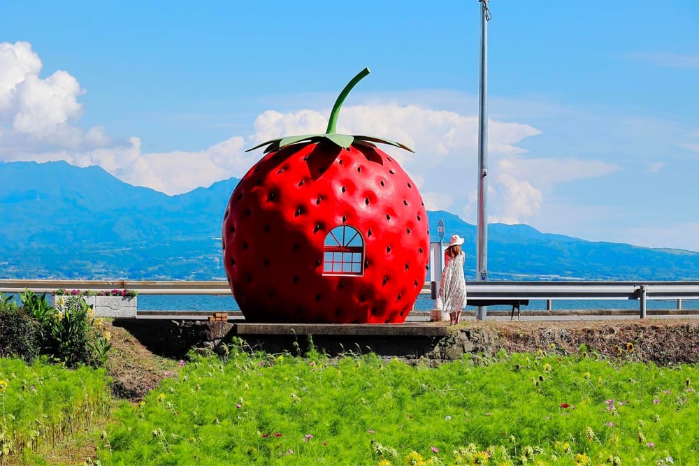 bus stop shaped like a strawberry
