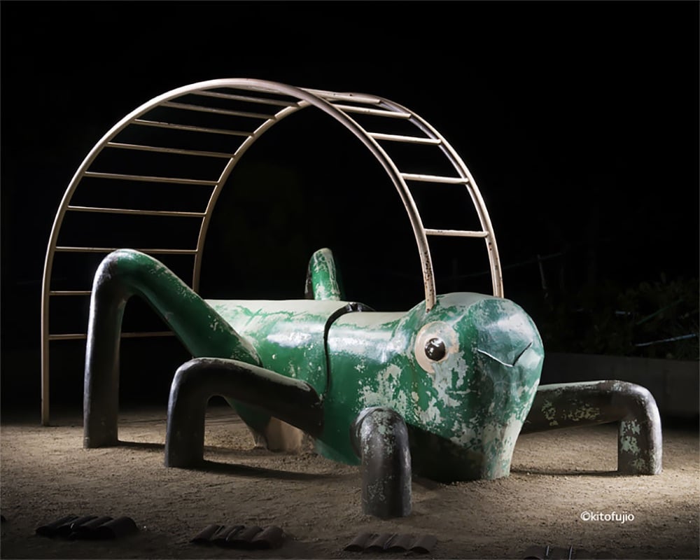 playground equipment shaped like a grasshopper