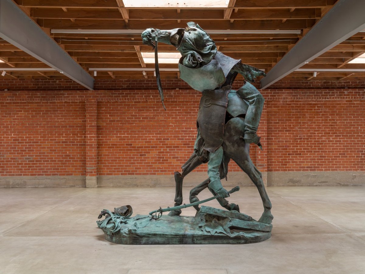 a sculpture of a monstrous figure