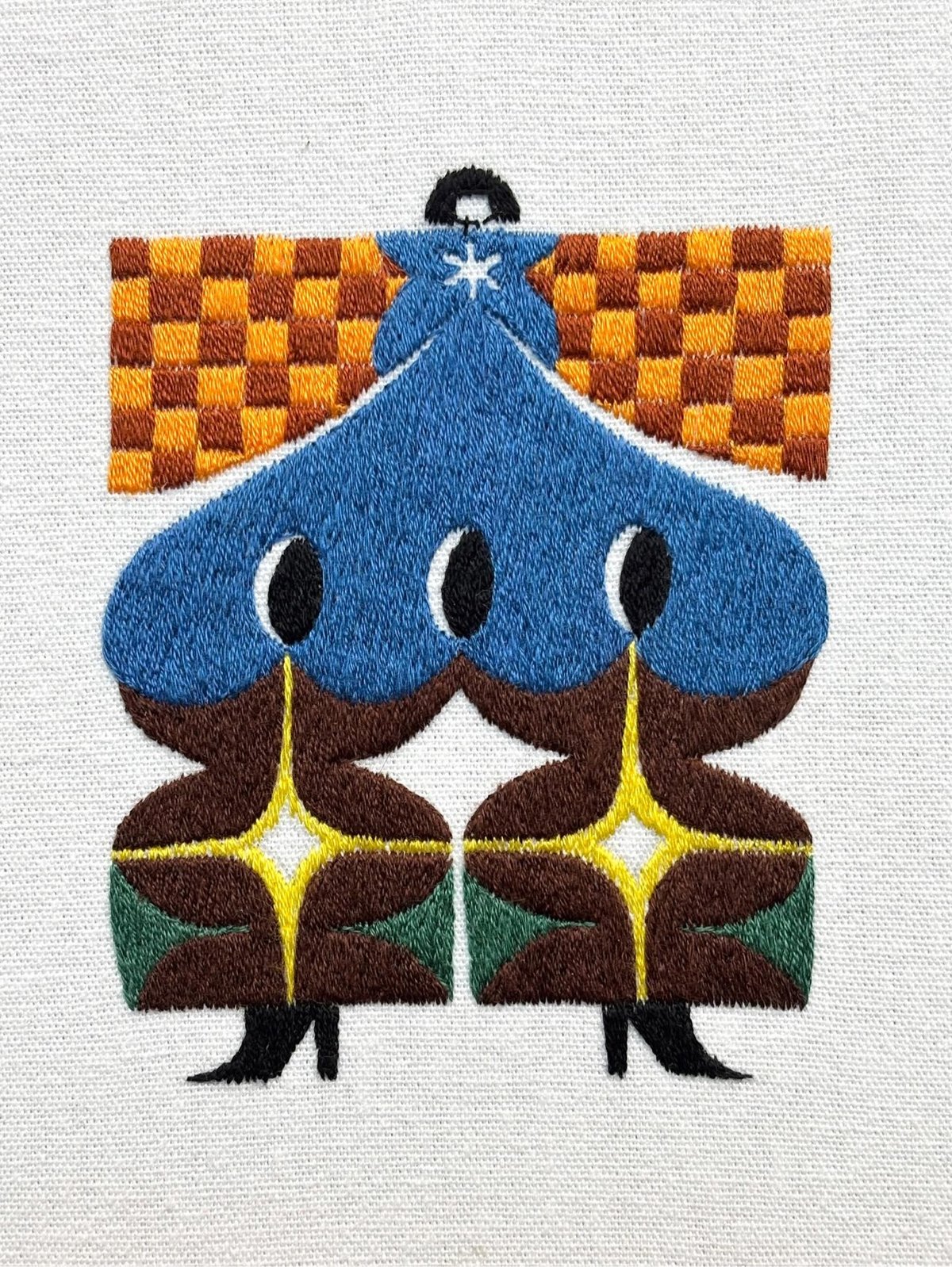 Embroidered figure in blue scalloped coat with three black ovals, against orange checkered background