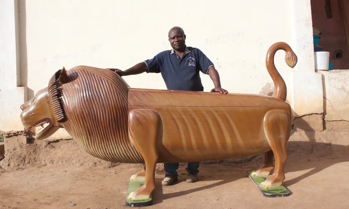 a human-sized coffin shaped like a lion