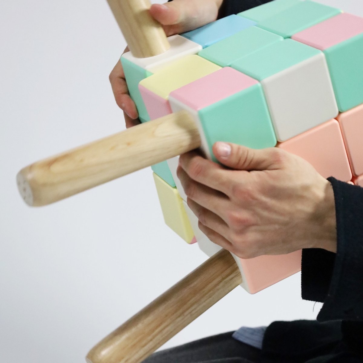 someone trying to solve the Rubik's Cube chair