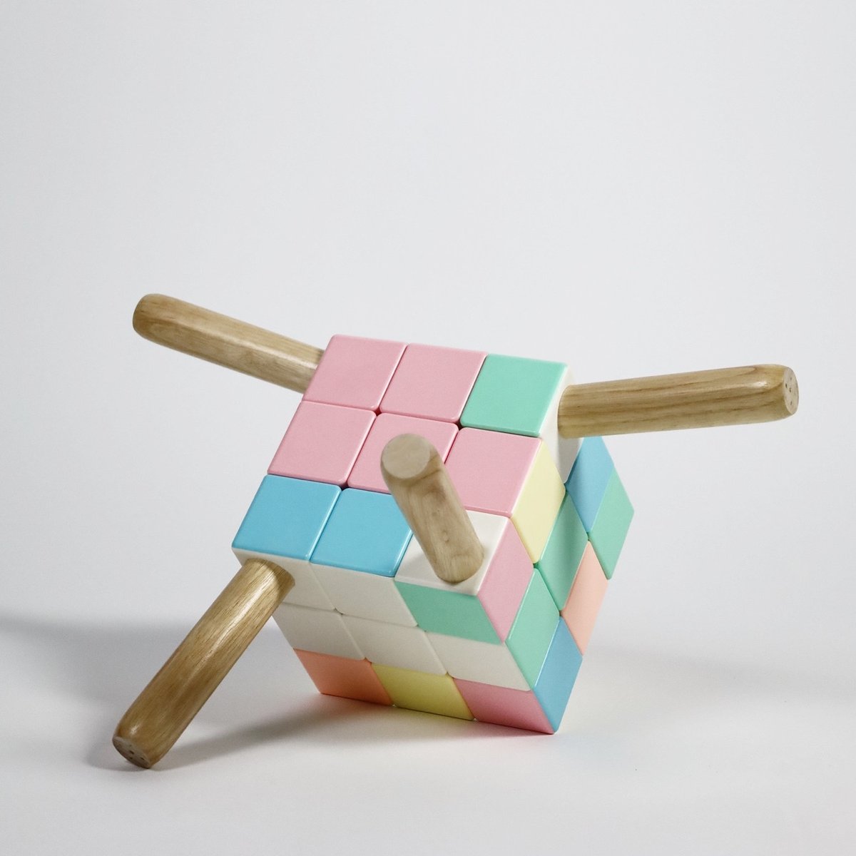 an unsolved Rubik's Cube chair sitting on the ground