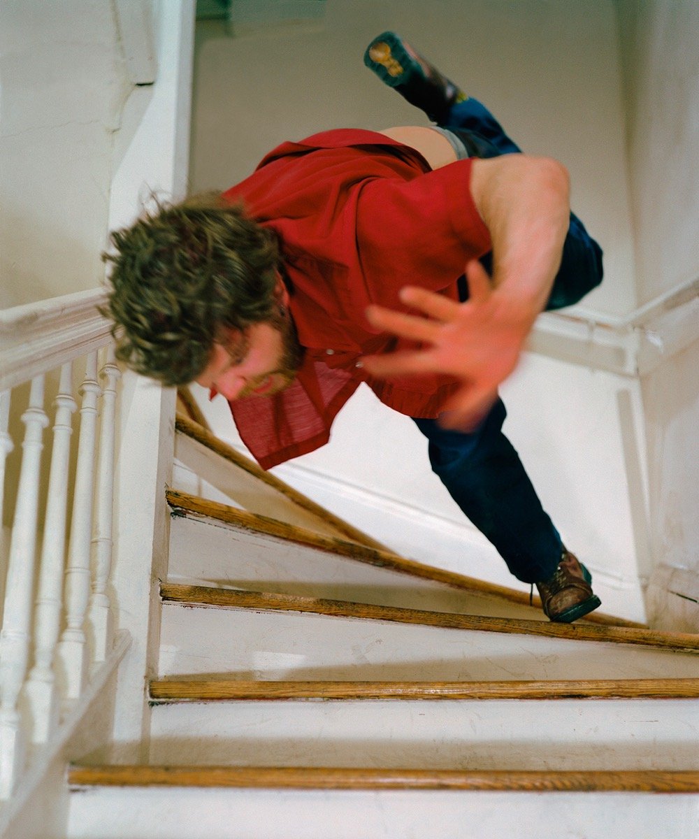 a man falling down the stairs