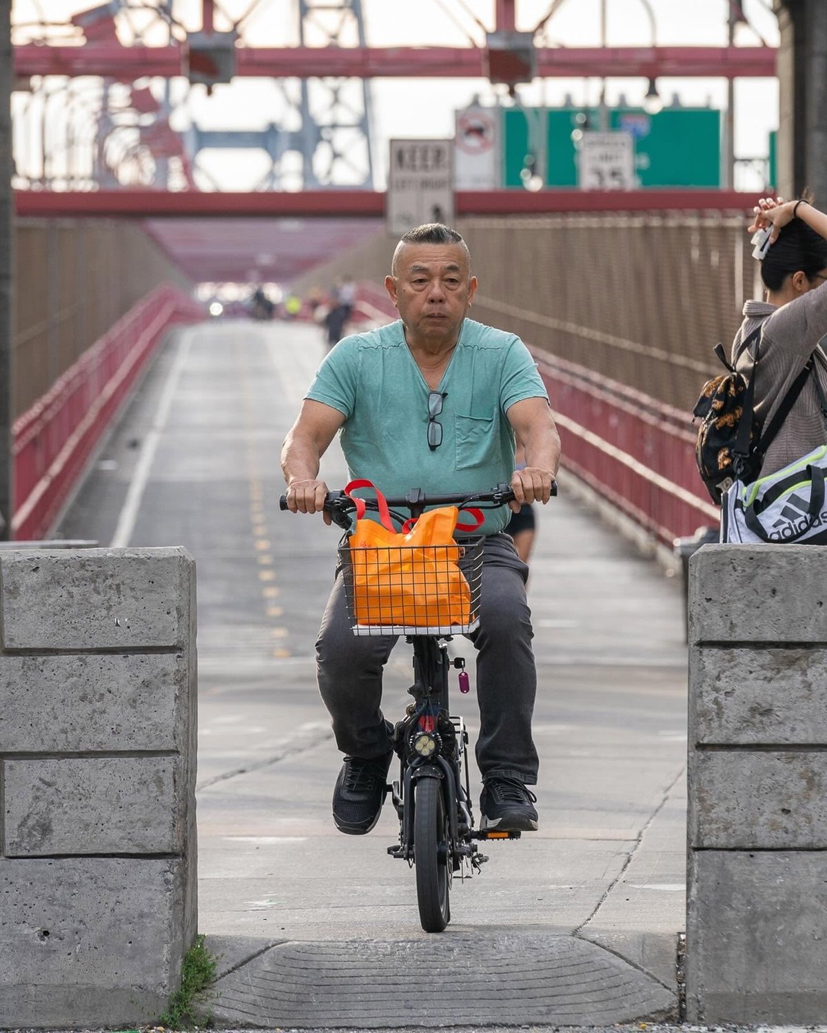 a biker exiting the Williamsburg Bridge bike path