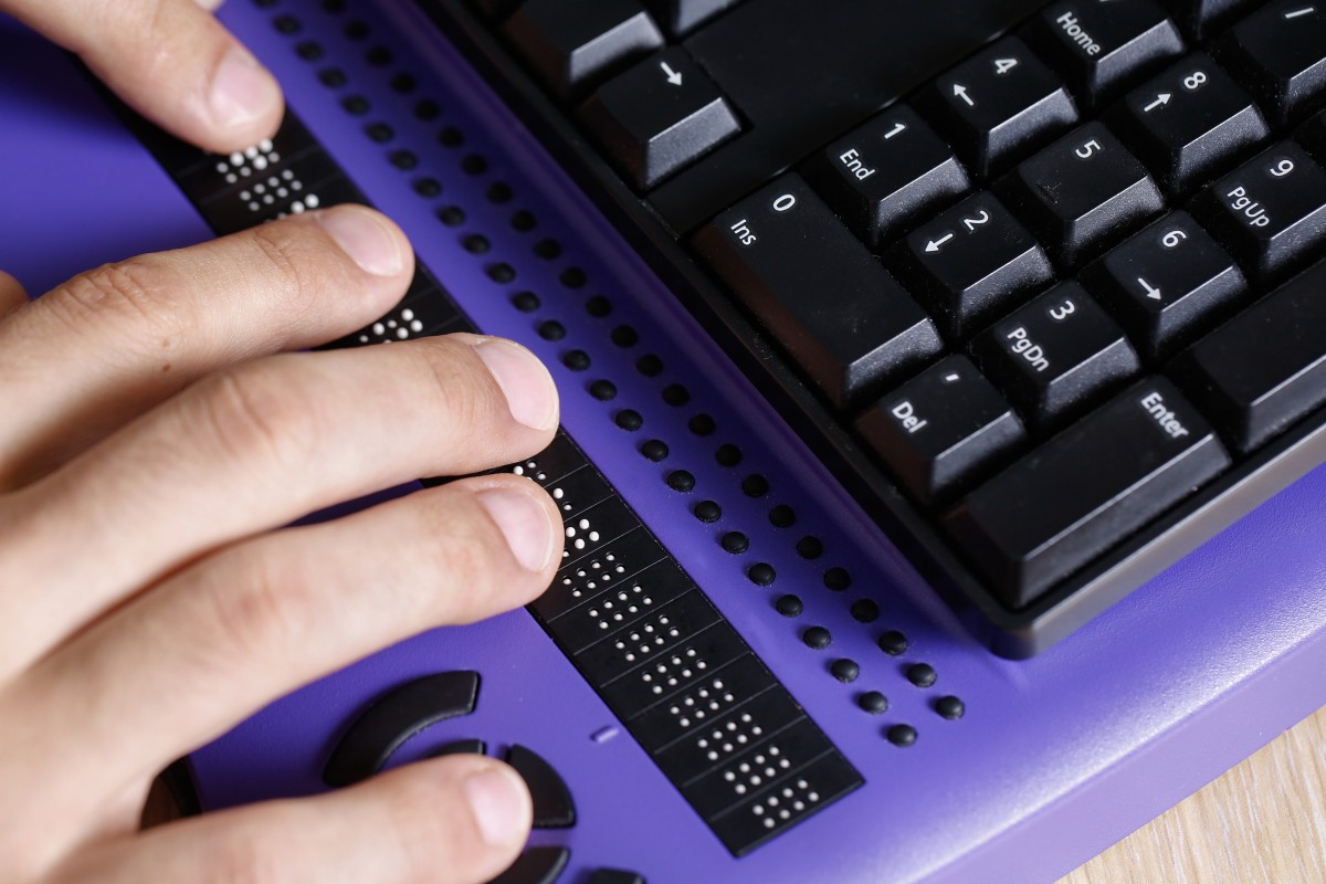 below a traditional keyboard is a braille interface for computing for sight-impaired users