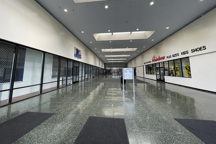 A long corridor in an empty shopping mall