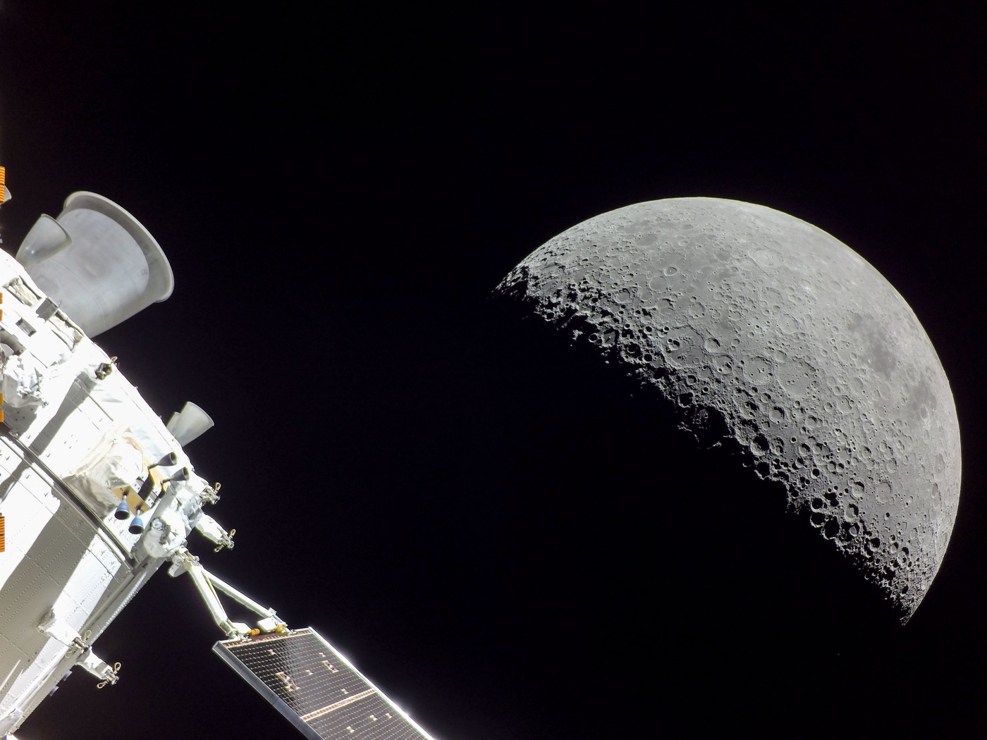 photo of the Moon with the Artemis I spacecraft in the foreground