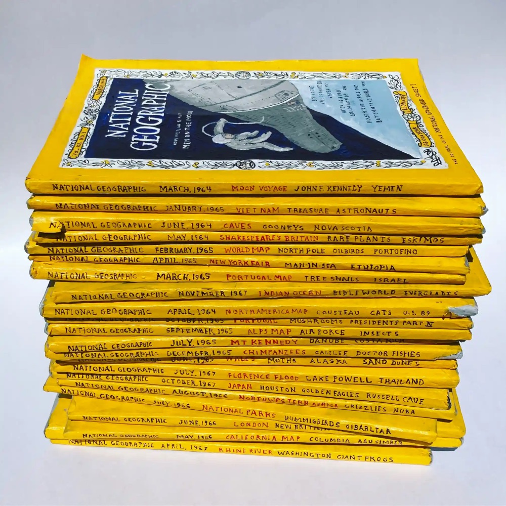 a stack of National Geographic magazines made from paper mâché
