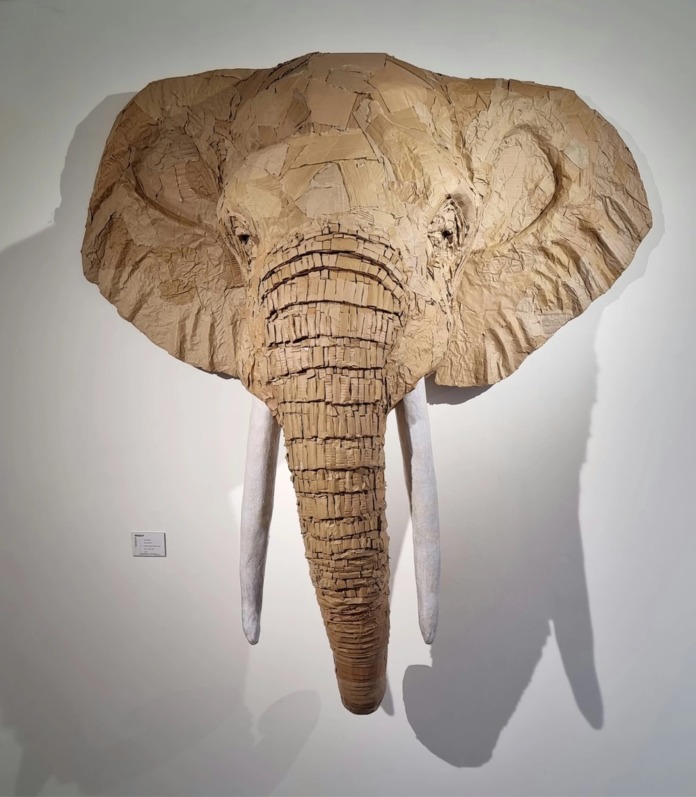 an elephant sculpture made from cardboard