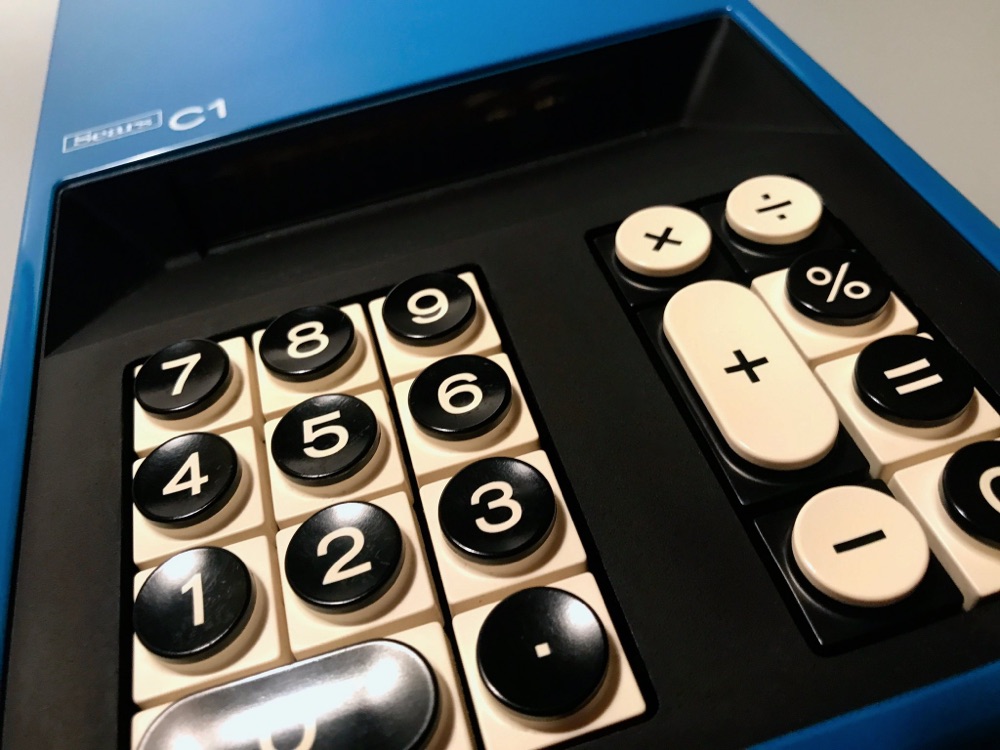 closeup photo of the chunky keys of a vintage calculator