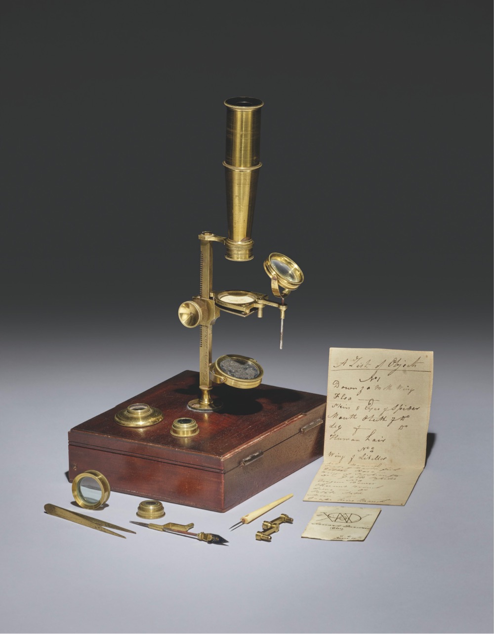 a brass microscope that was owned by Charles Darwin