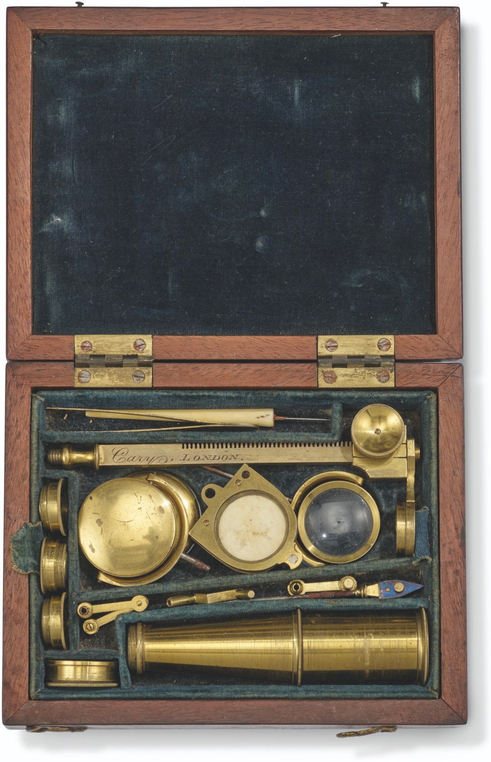 a brass microscope that was owned by Charles Darwin, packed into its box