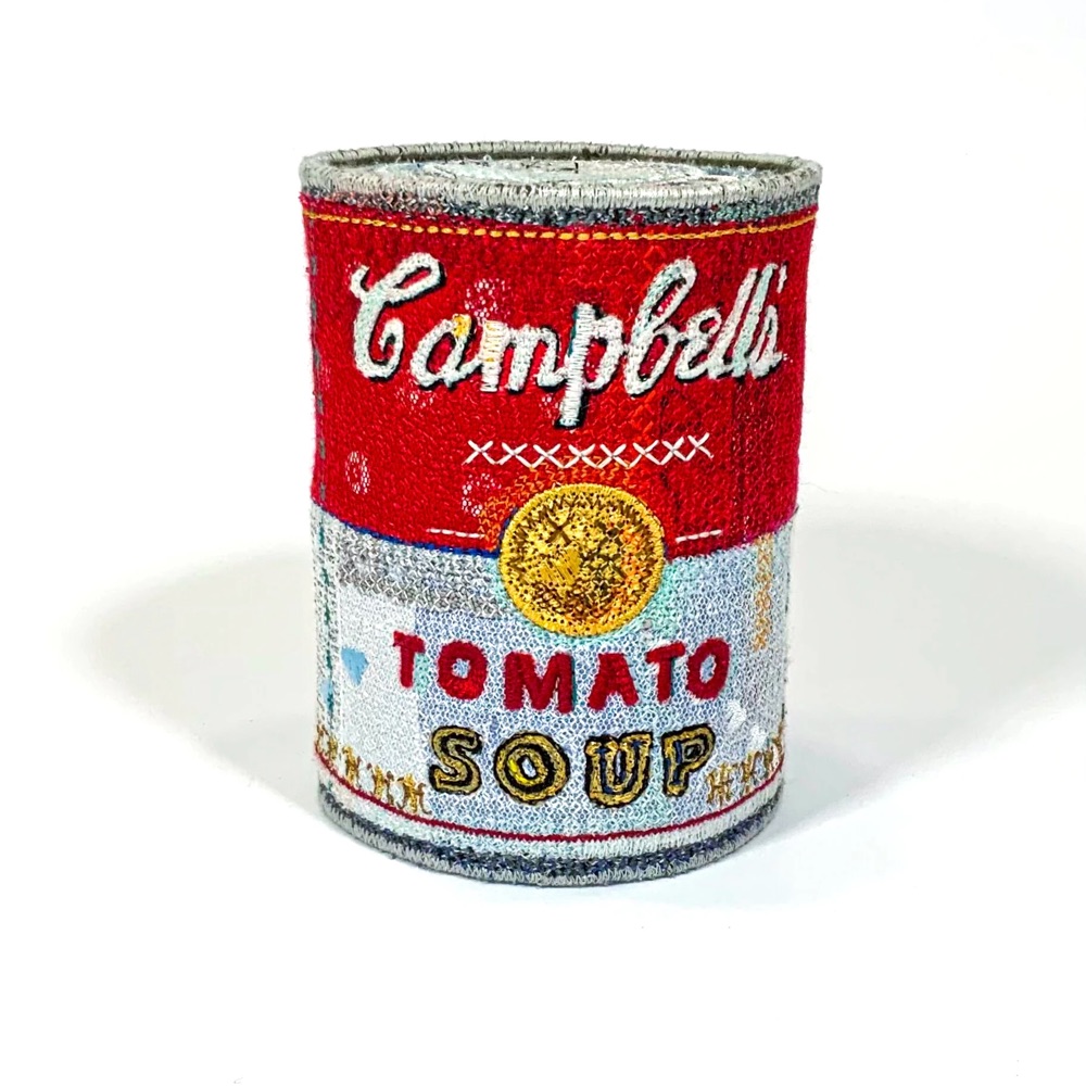 embroidered sculpture of a Campbell's tomato soup can