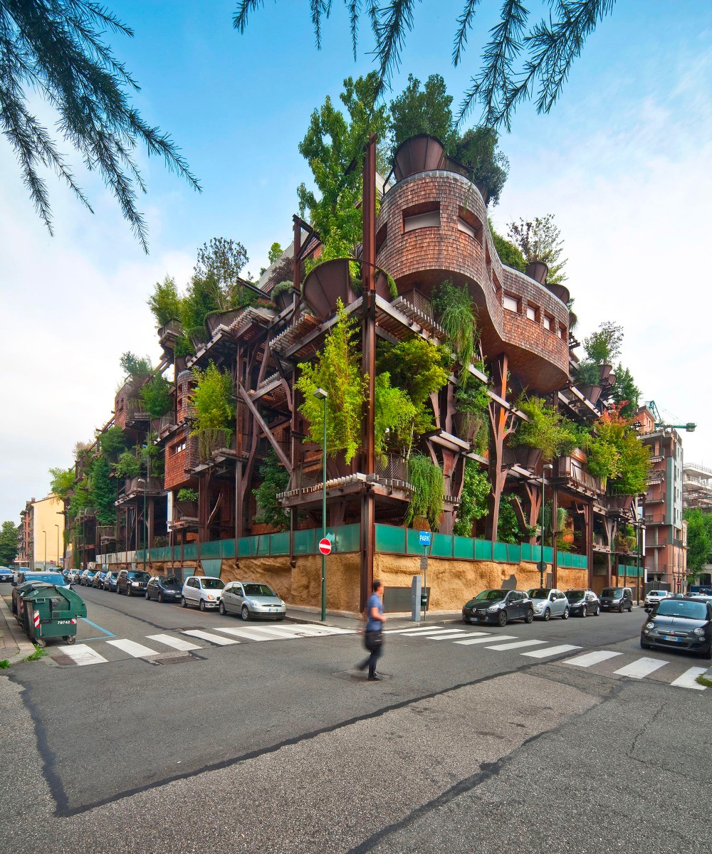 a building with plants and trees all over it