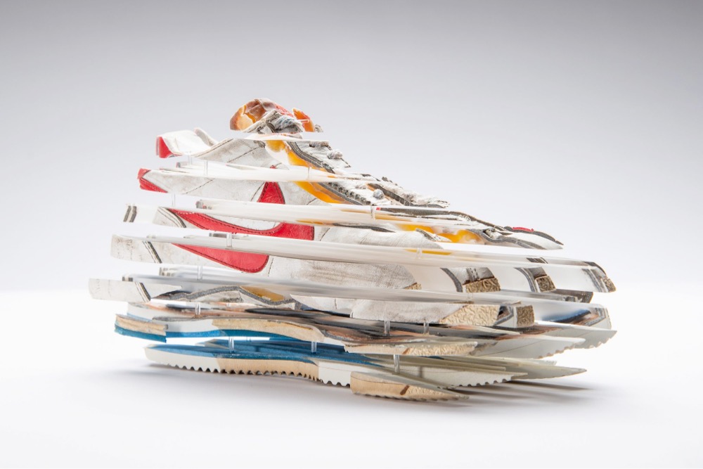 a sculpture of a shoe sliced apart and put loosely back together