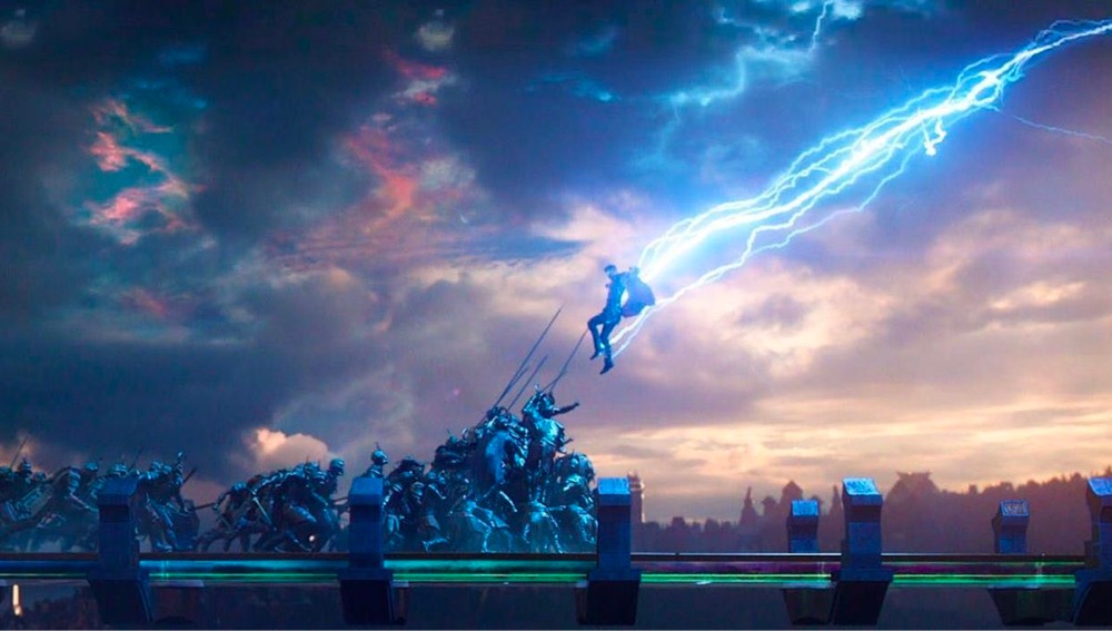 superhero Thor descends with his hammer raised onto a crowd of bad guys