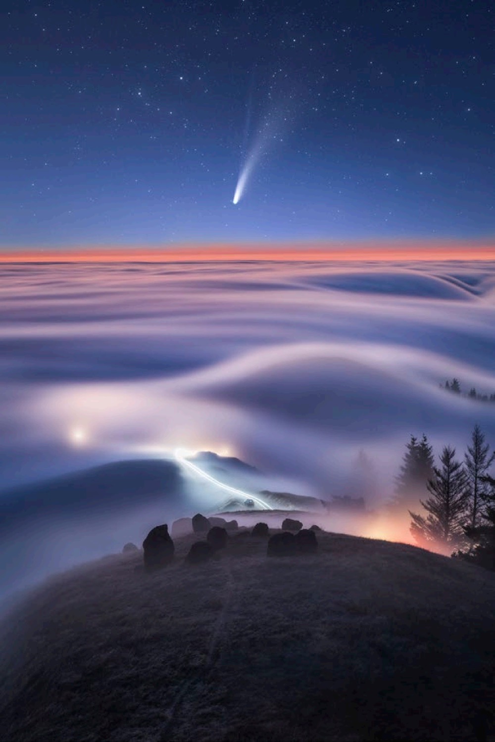 Comet Neowise over a foggy landscape