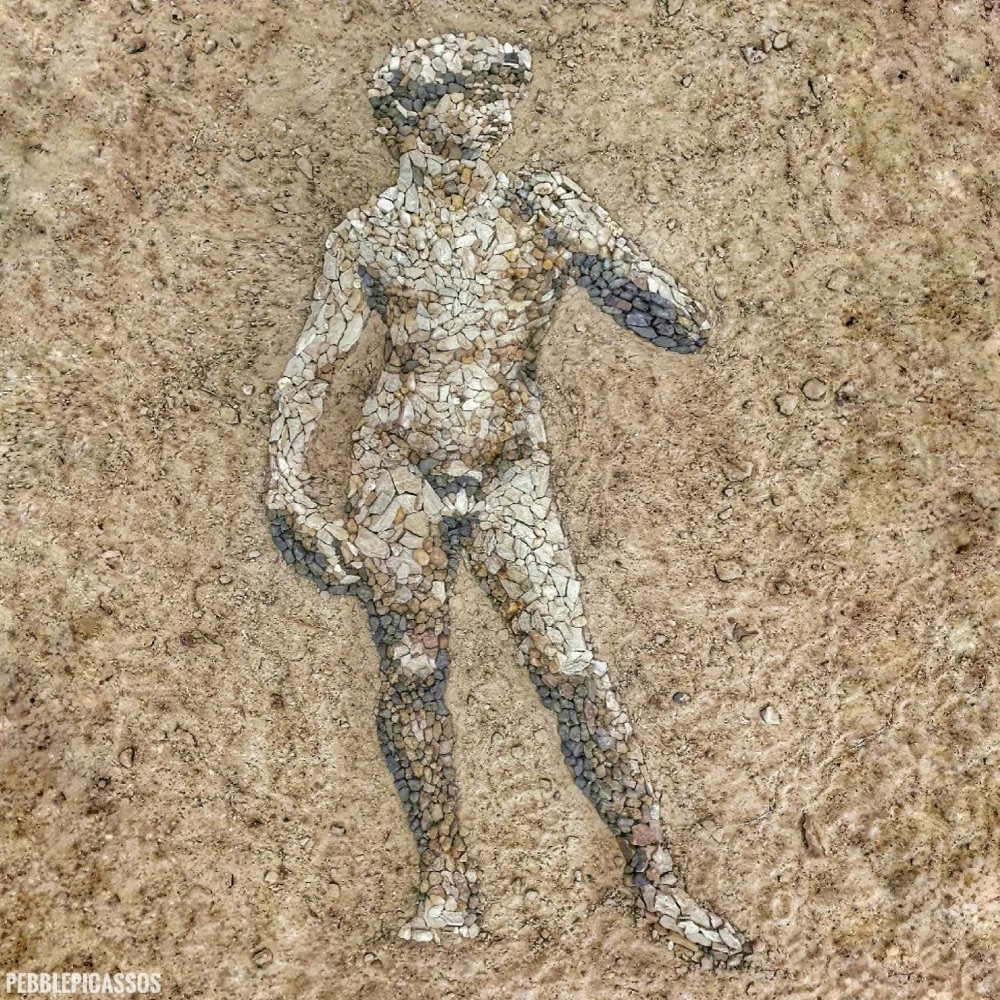 representation of Michaelangelo's David made out of pebbles