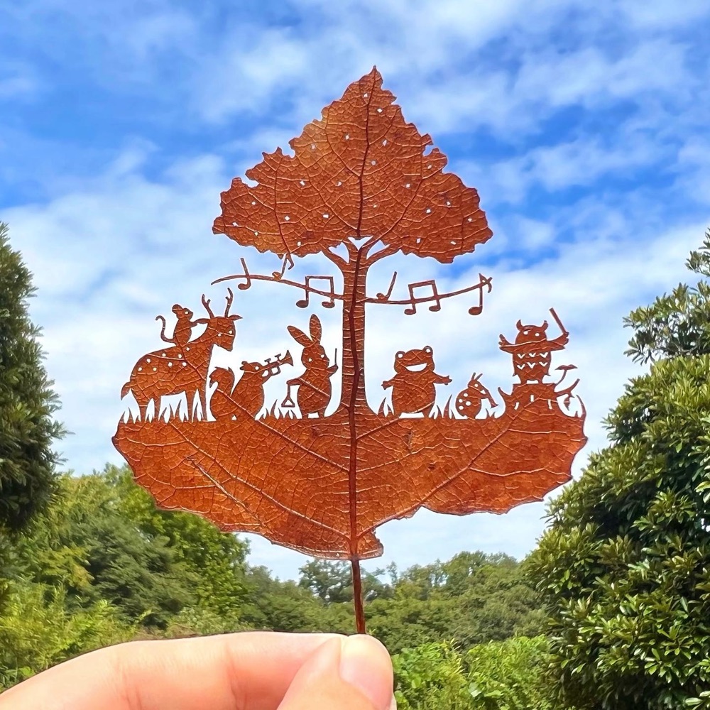 leaf cutout art of an animal band