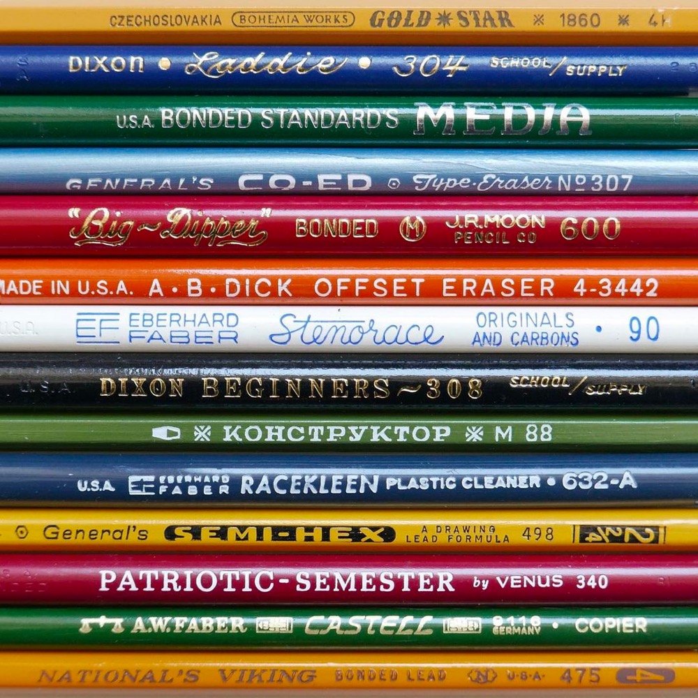 a bunch of pencils showing the printing and logos on them