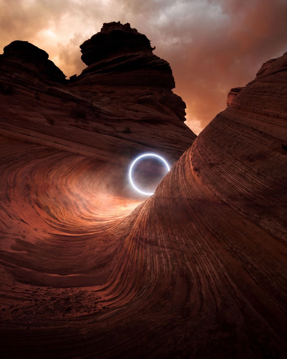 a glowing disk lights up a rocky landscape