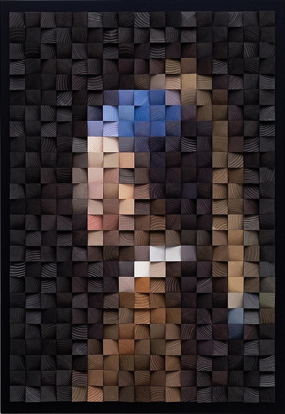 a chunky abstract representation of Vermeer's Girl with a Pearl Earring made from colorful wooden blocks